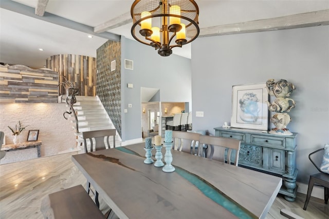 931 Gulf Blvd, Belleair Beach, FL 33786 - dining space featuring high vaulted ceiling, baseboards, stairs, a chandelier, and beamed ceiling