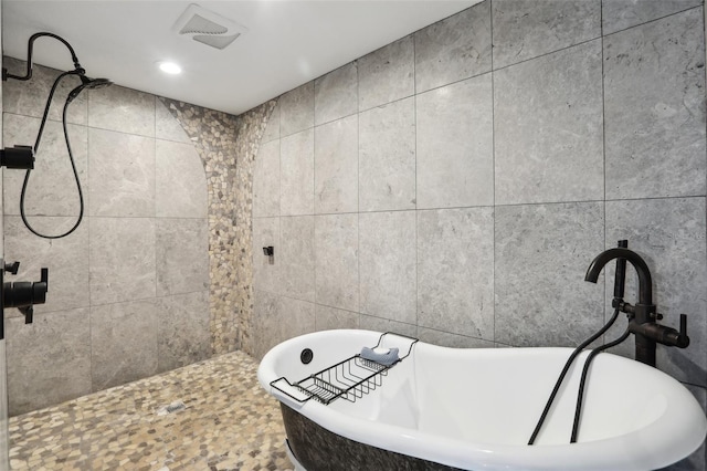 931 Gulf Blvd, Belleair Beach, FL 33786 - full bath with a soaking tub and a tile shower