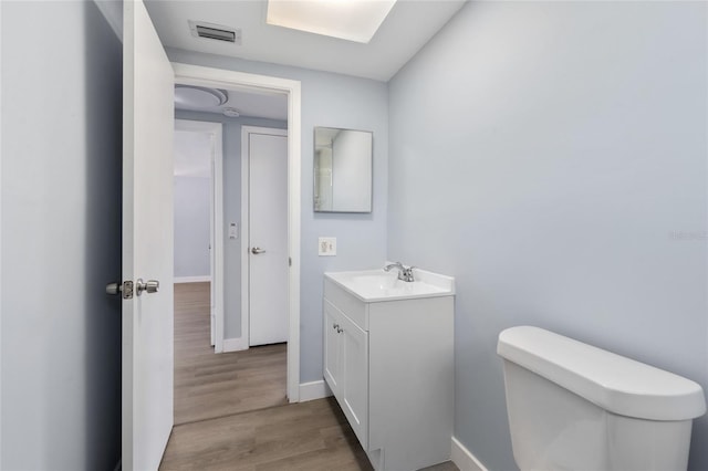 5027 Overton Dr, New Port Richey, FL 34652 - bathroom featuring vanity and wood finished floors