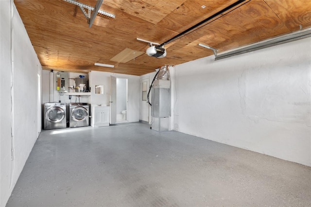 5027 Overton Dr, New Port Richey, FL 34652 - garage with washer and dryer and a garage door opener