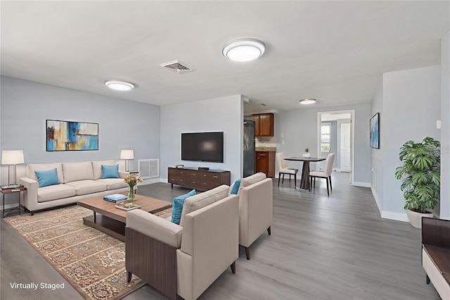 5027 Overton Dr, New Port Richey, FL 34652 - living area with light wood-style floors and baseboards