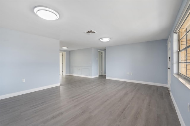 5027 Overton Dr, New Port Richey, FL 34652 - empty room featuring wood finished floors and baseboards