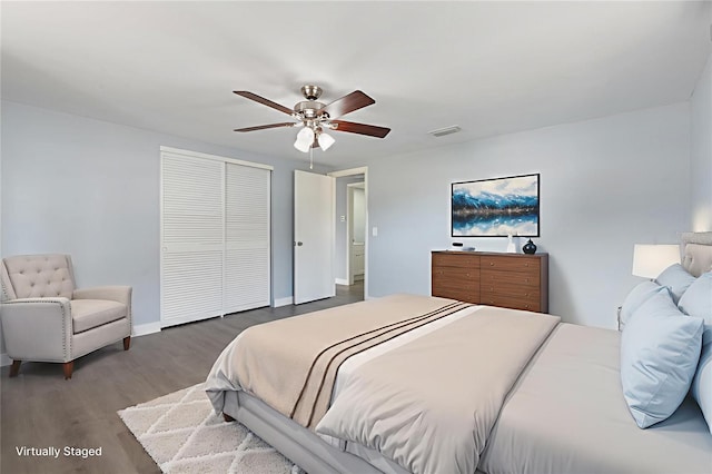 5027 Overton Dr, New Port Richey, FL 34652 - bedroom with wood finished floors, a closet, and a ceiling fan