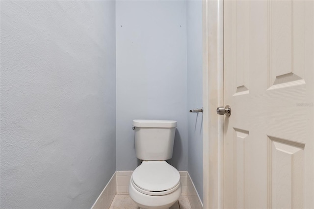 5027 Overton Dr, New Port Richey, FL 34652 - bathroom with toilet and baseboards
