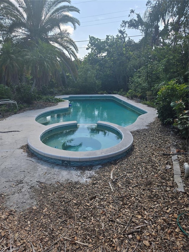 1831 Pasadena Dr, Dunedin, FL 34698 - view of pool with a pool with connected hot tub