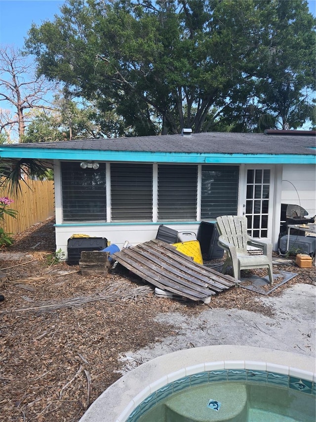 1831 Pasadena Dr, Dunedin, FL 34698 - rear view of property featuring a hot tub