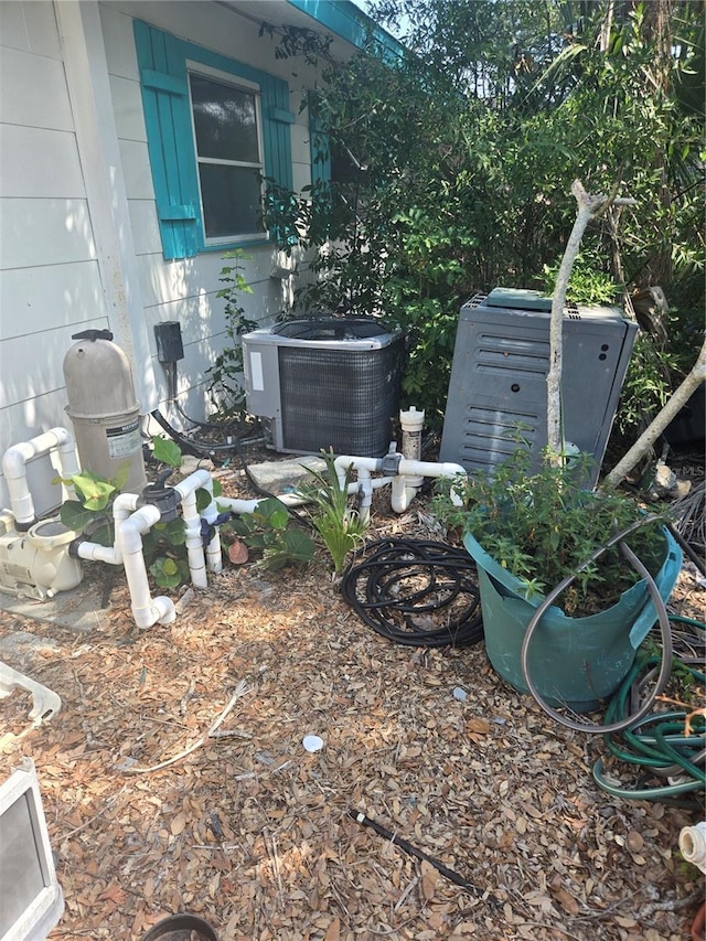 1831 Pasadena Dr, Dunedin, FL 34698 - view of yard featuring central AC
