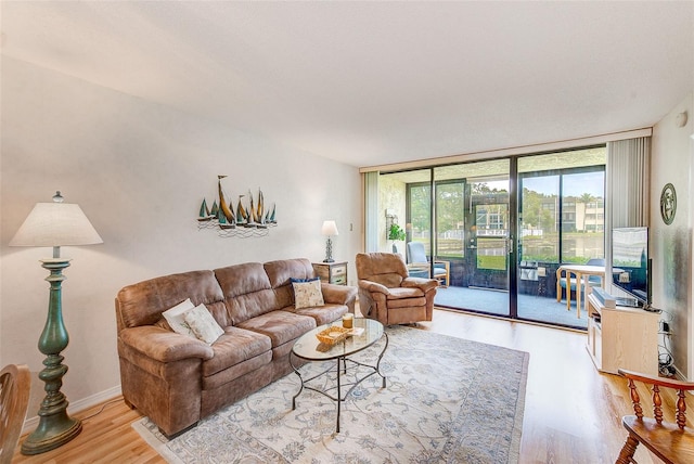 14130 Rosemary Ln Unit 4115, Largo, FL 33774 - living room with a wall of windows and wood finished floors