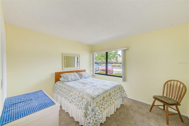 14130 Rosemary Ln Unit 4115, Largo, FL 33774 - bedroom featuring carpet floors, baseboards, and a textured ceiling