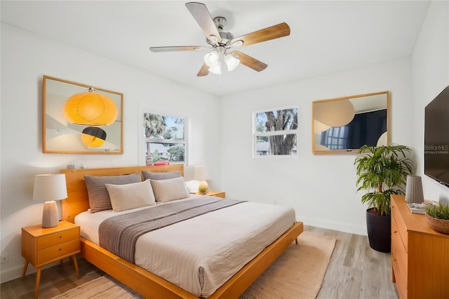 2220 3rd Ave E, Bradenton, FL 34208 - bedroom featuring light wood finished floors, baseboards, and a ceiling fan