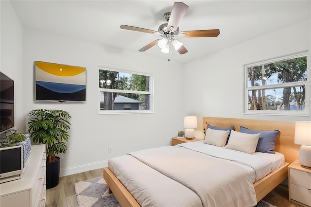 2220 3rd Ave E, Bradenton, FL 34208 - bedroom featuring light wood-type flooring, ceiling fan, and baseboards