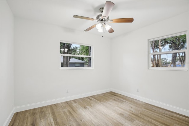 2220 3rd Ave E, Bradenton, FL 34208 - unfurnished room with baseboards, light wood-style floors, and ceiling fan
