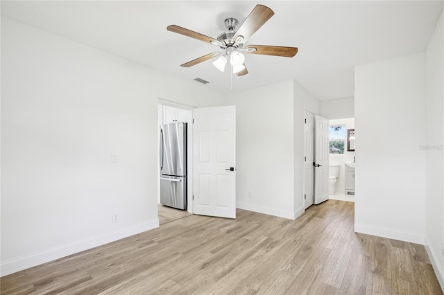 2220 3rd Ave E, Bradenton, FL 34208 - empty room with light wood-style flooring, a ceiling fan, and baseboards