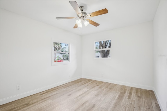 2220 3rd Ave E, Bradenton, FL 34208 - unfurnished room with light wood finished floors, baseboards, and a ceiling fan