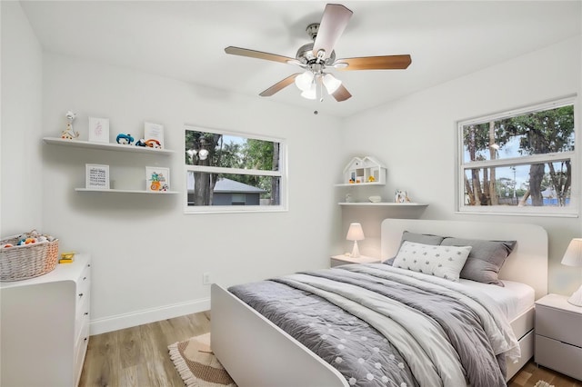 2220 3rd Ave E, Bradenton, FL 34208 - bedroom featuring light wood finished floors, baseboards, and ceiling fan