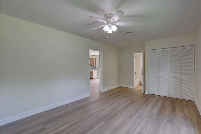 5201 E Jasmine Ln, Inverness, FL 34453 - unfurnished bedroom with baseboards, wood finished floors, a closet, and ceiling fan