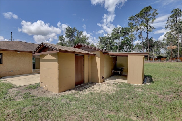 5201 E Jasmine Ln, Inverness, FL 34453 - view of property exterior with a yard and a shingled roof