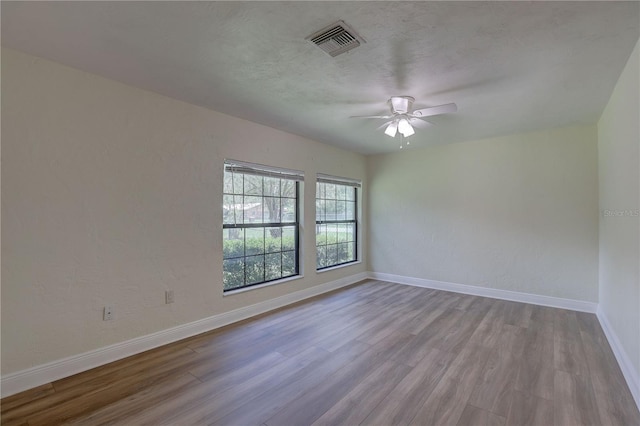 5201 E Jasmine Ln, Inverness, FL 34453 - spare room with wood finished floors, baseboards, and a ceiling fan