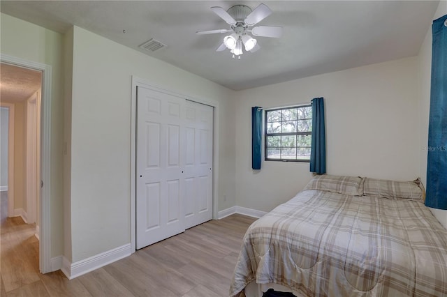 5201 E Jasmine Ln, Inverness, FL 34453 - bedroom featuring wood finished floors, a closet, baseboards, and a ceiling fan