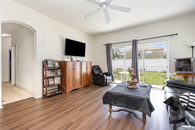 7603 Wood Violet Dr, Gibsonton, FL 33534 - living room featuring arched walkways, wood finished floors, and ceiling fan
