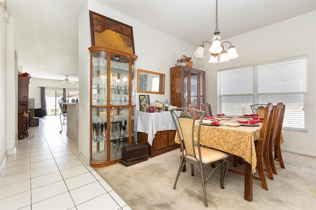 7603 Wood Violet Dr, Gibsonton, FL 33534 - dining space with a chandelier, light colored carpet, light tile patterned flooring, ceiling fan, and baseboards