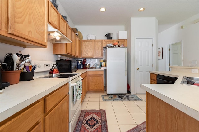 7603 Wood Violet Dr, Gibsonton, FL 33534 - kitchen featuring white appliances, under cabinet range hood, light countertops, light tile patterned floors, and recessed lighting