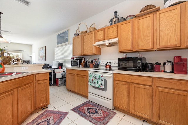 7603 Wood Violet Dr, Gibsonton, FL 33534 - kitchen featuring under cabinet range hood, white electric range, light countertops, and light tile patterned floors