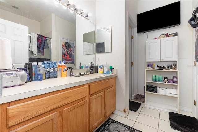 7603 Wood Violet Dr, Gibsonton, FL 33534 - full bath featuring tile patterned floors, vanity, and baseboards