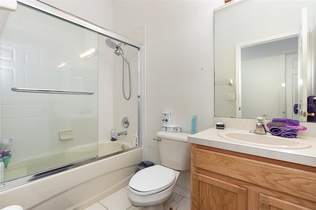 7603 Wood Violet Dr, Gibsonton, FL 33534 - bathroom with toilet, vanity, bath / shower combo with glass door, and tile patterned floors