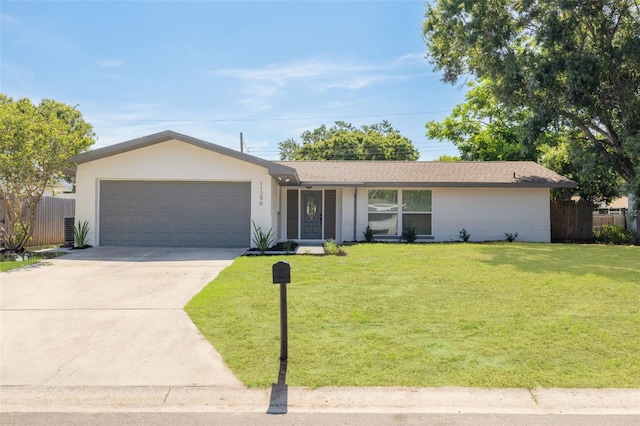 11296 115th St, Largo, FL 33778 - ranch-style house with a garage, driveway, and stucco siding
