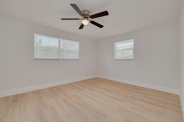 11296 115th St, Largo, FL 33778 - empty room with baseboards, wood finished floors, and ceiling fan