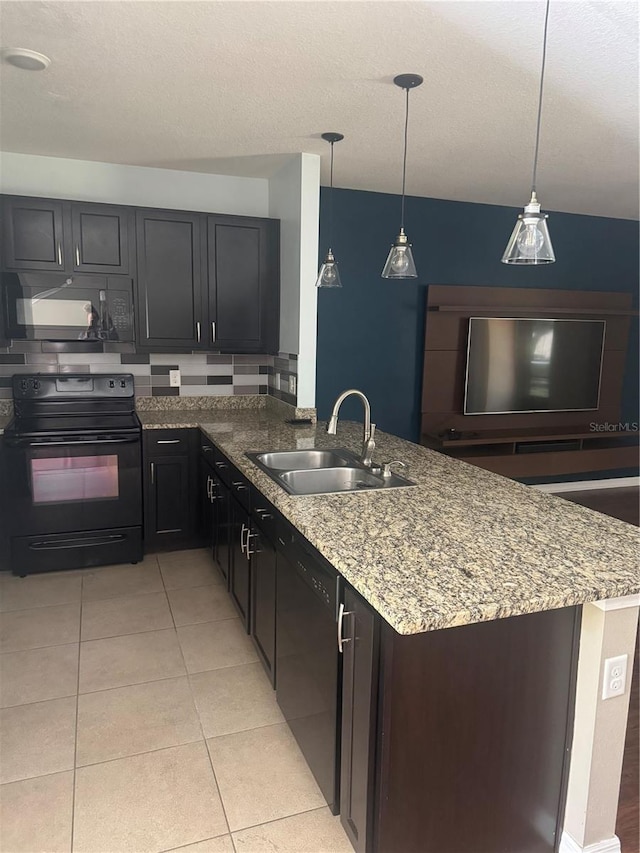 9833 Hound Chase Dr, Gibsonton, FL 33534 - kitchen with black appliances, a sink, a peninsula, light stone countertops, and light tile patterned floors