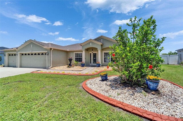 6425 Clair Shore Dr, Apollo Beach, FL 33572 - ranch-style home featuring stucco siding, a garage, and driveway