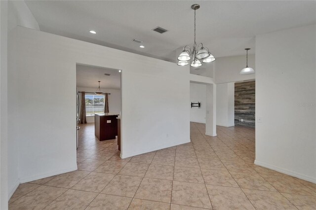 6425 Clair Shore Dr, Apollo Beach, FL 33572 - spare room with a chandelier, light tile patterned floors, and recessed lighting