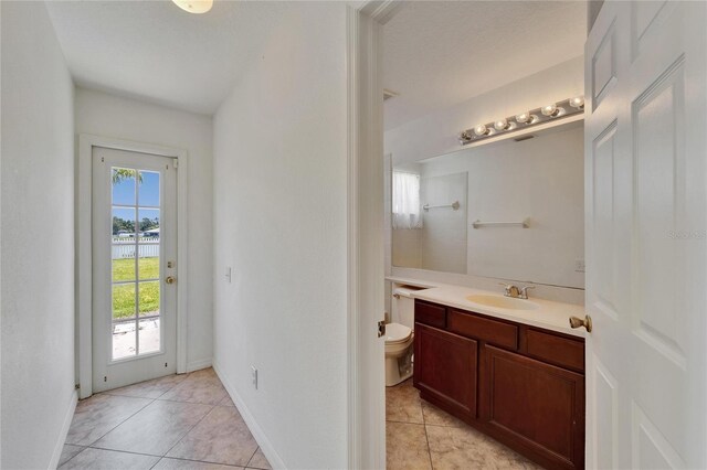 6425 Clair Shore Dr, Apollo Beach, FL 33572 - bathroom featuring tile patterned floors, vanity, toilet, and a shower