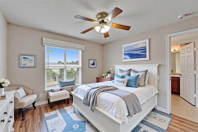6425 Clair Shore Dr, Apollo Beach, FL 33572 - bedroom featuring light wood-type flooring, baseboards, and ceiling fan