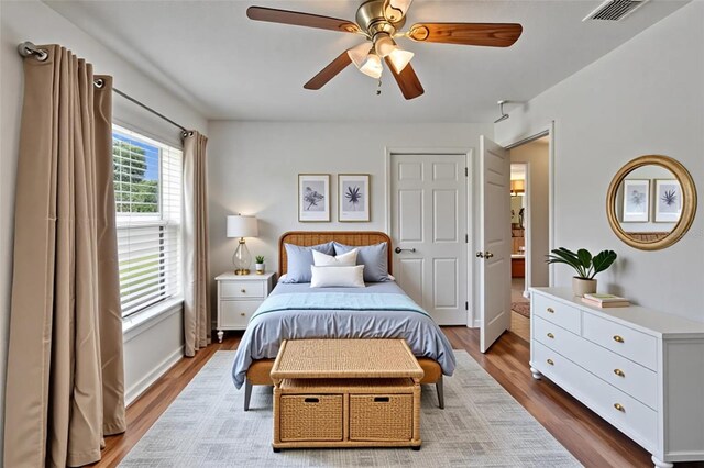 6425 Clair Shore Dr, Apollo Beach, FL 33572 - bedroom with wood finished floors and ceiling fan