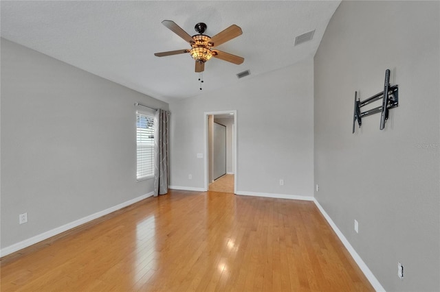 6425 Clair Shore Dr, Apollo Beach, FL 33572 - empty room featuring a ceiling fan, vaulted ceiling, light wood-type flooring, and baseboards