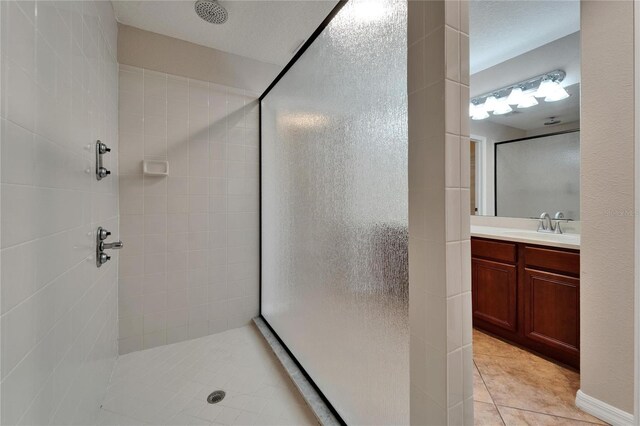 6425 Clair Shore Dr, Apollo Beach, FL 33572 - bathroom featuring a shower stall, tile patterned floors, and vanity