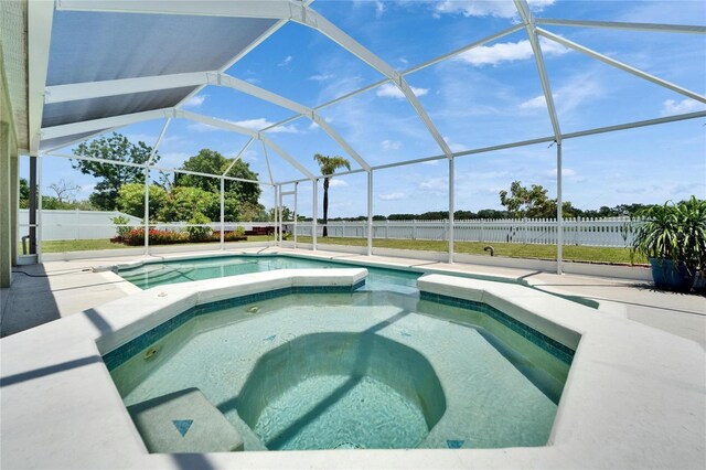 6425 Clair Shore Dr, Apollo Beach, FL 33572 - view of swimming pool featuring a fenced backyard, a patio area, an in-ground hot tub, and glass enclosure