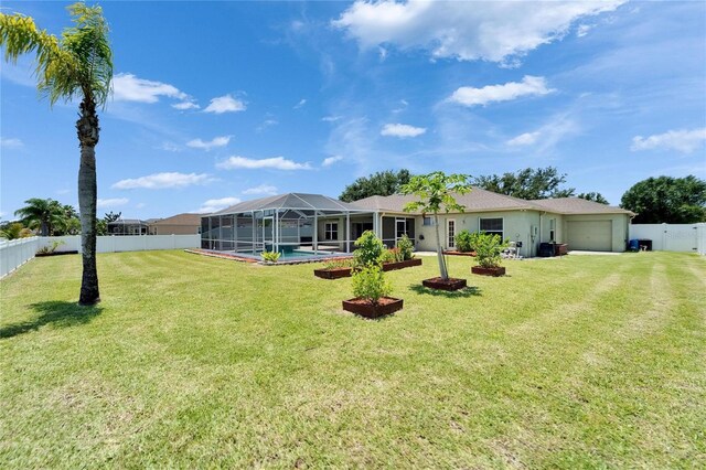 6425 Clair Shore Dr, Apollo Beach, FL 33572 - view of front of property with an attached garage, a lanai, and stucco siding