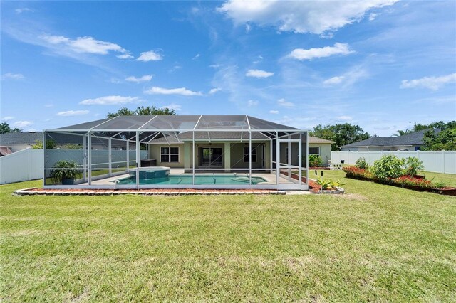 6425 Clair Shore Dr, Apollo Beach, FL 33572 - rear view of property featuring glass enclosure