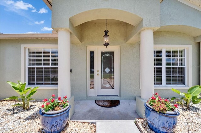 6425 Clair Shore Dr, Apollo Beach, FL 33572 - doorway to property with stucco siding