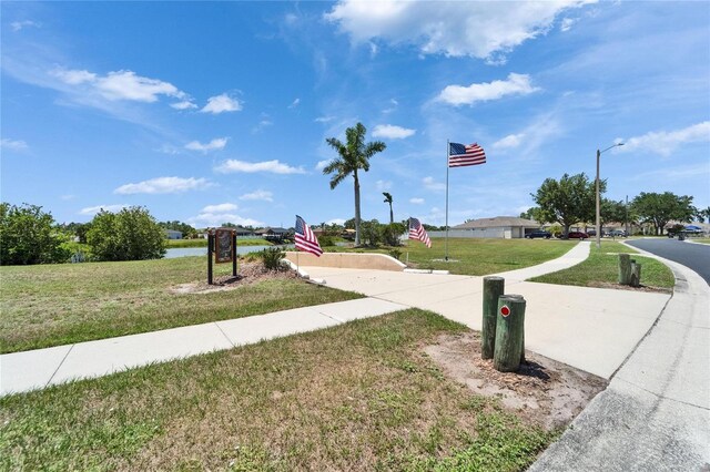 6425 Clair Shore Dr, Apollo Beach, FL 33572 - view of asphalt street featuring sidewalks, street lights, and a water view