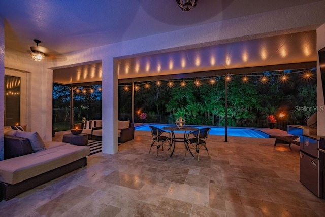 15934 Sorawater Dr, Lithia, FL 33547 - patio at night featuring an outdoor hangout area and a patio area