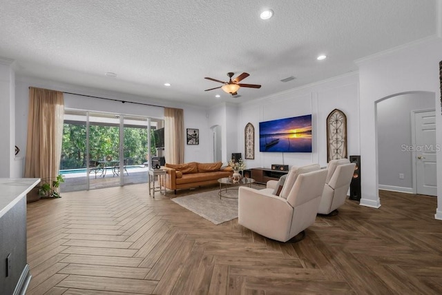 15934 Sorawater Dr, Lithia, FL 33547 - living area featuring a textured ceiling, crown molding, a ceiling fan, recessed lighting, and arched walkways