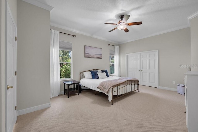 15934 Sorawater Dr, Lithia, FL 33547 - bedroom featuring light carpet, ornamental molding, baseboards, a closet, and a ceiling fan