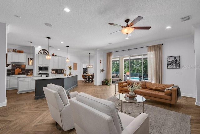 15934 Sorawater Dr, Lithia, FL 33547 - living area featuring a textured ceiling, ceiling fan, and recessed lighting