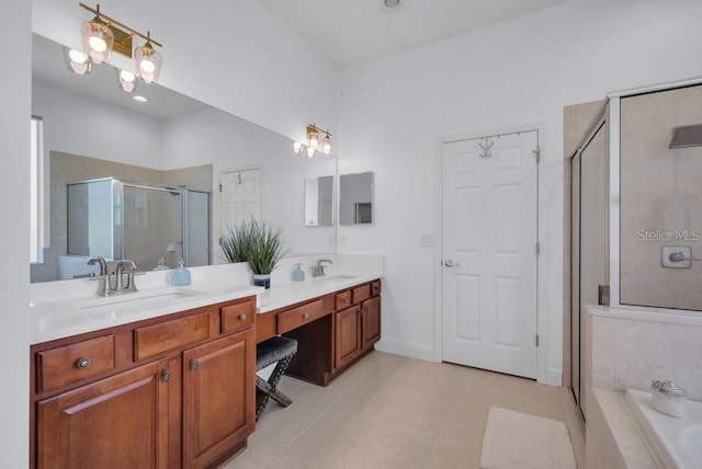15934 Sorawater Dr, Lithia, FL 33547 - full bathroom with a stall shower, double vanity, tile patterned floors, and a bath