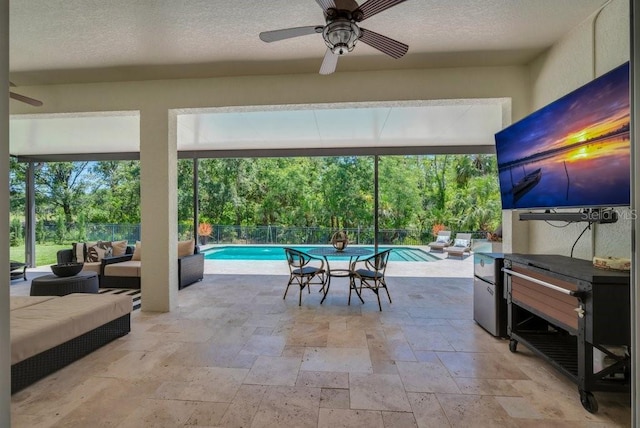 15934 Sorawater Dr, Lithia, FL 33547 - view of patio with outdoor lounge area, ceiling fan, and view of scattered trees